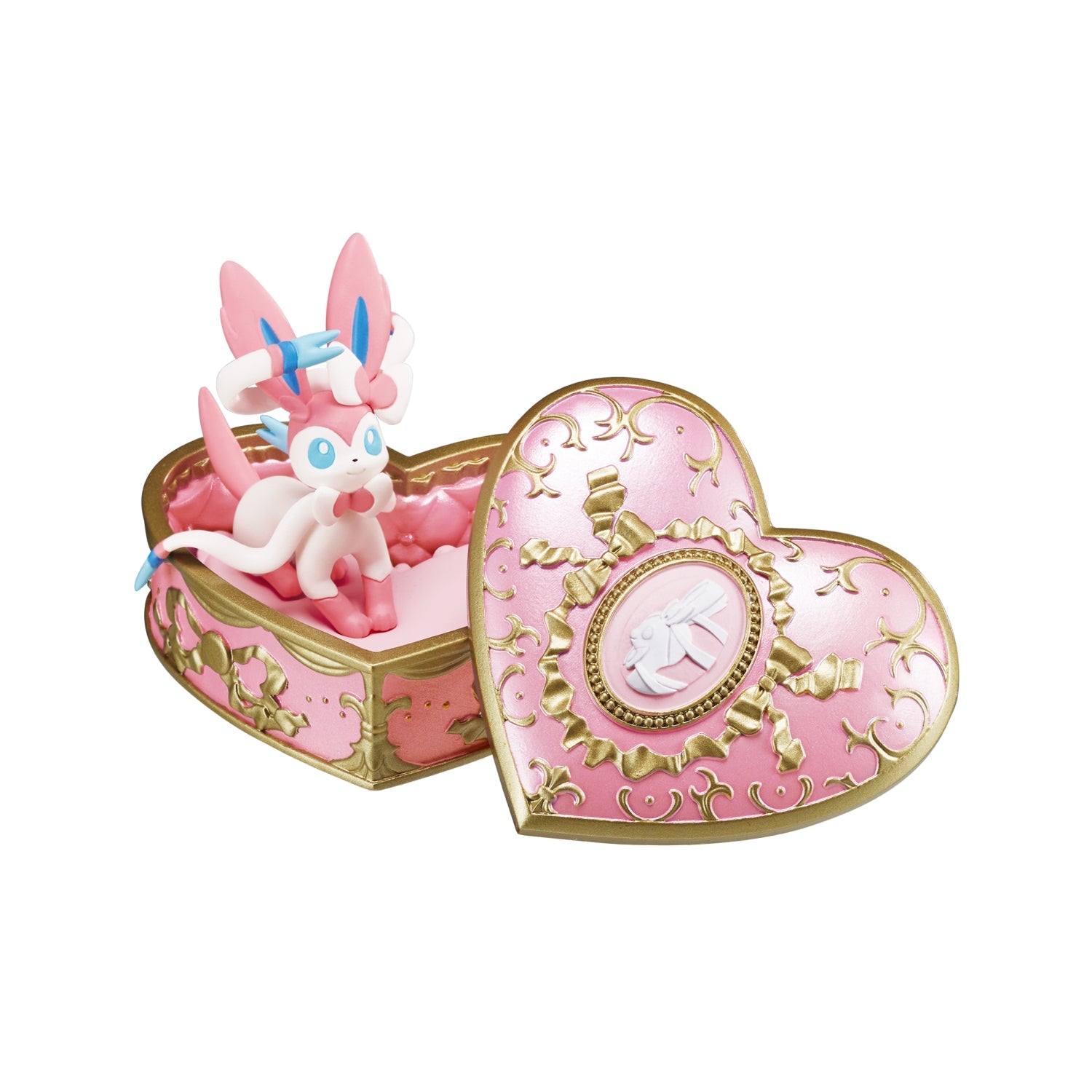 Pink heart-shaped box with a figurine inside on a white background